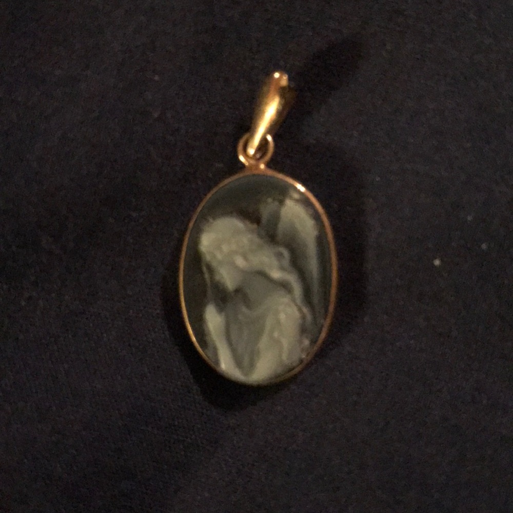 White Angel on blue pendant.